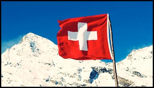 <img data-src="swiss flag flying.png" alt="Swiss flags">