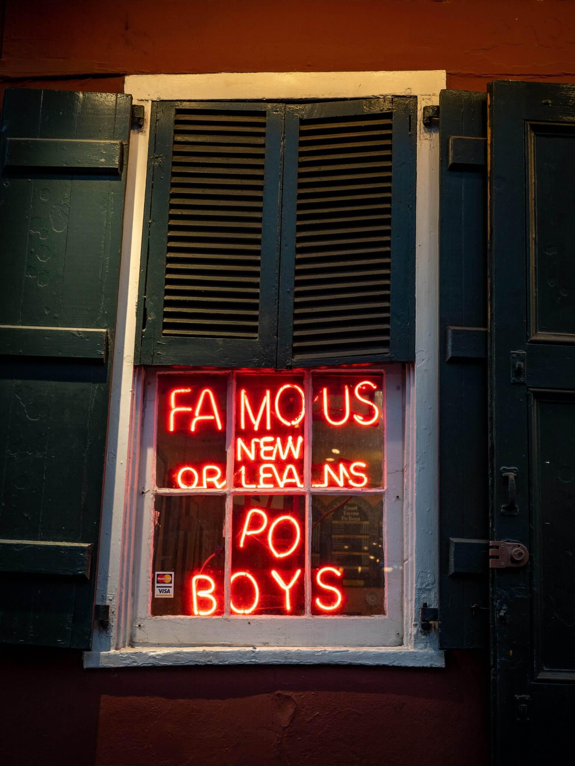 Neon sign boasting about po-boys